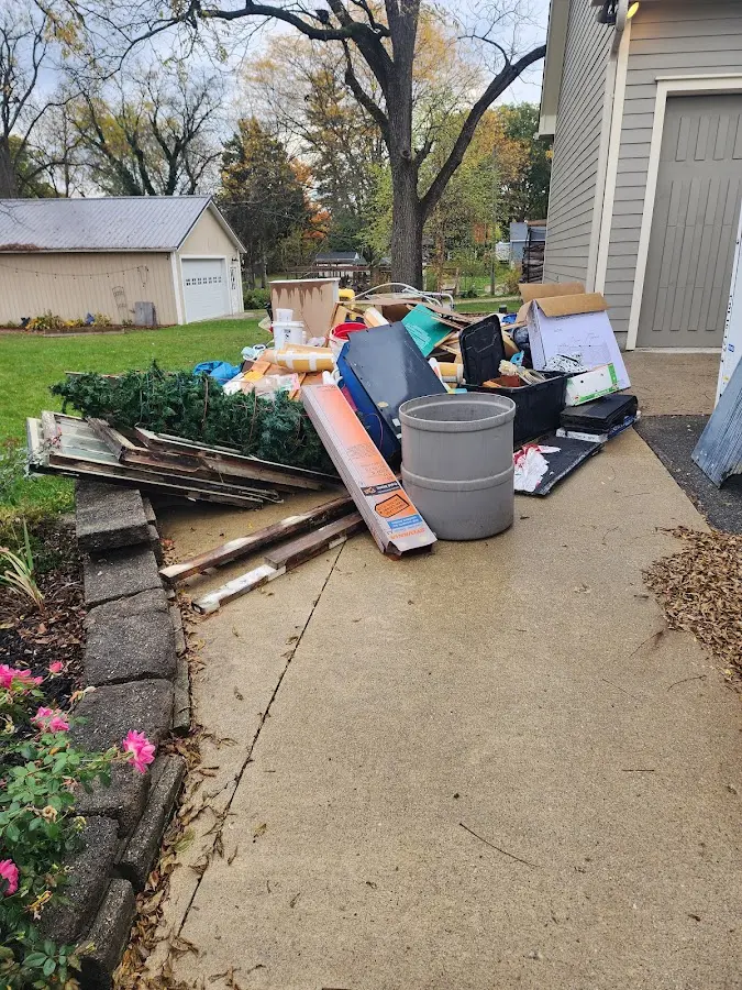 Dumpster being loaded with debris for 30 Yard Dumpster Rental in Deerfield